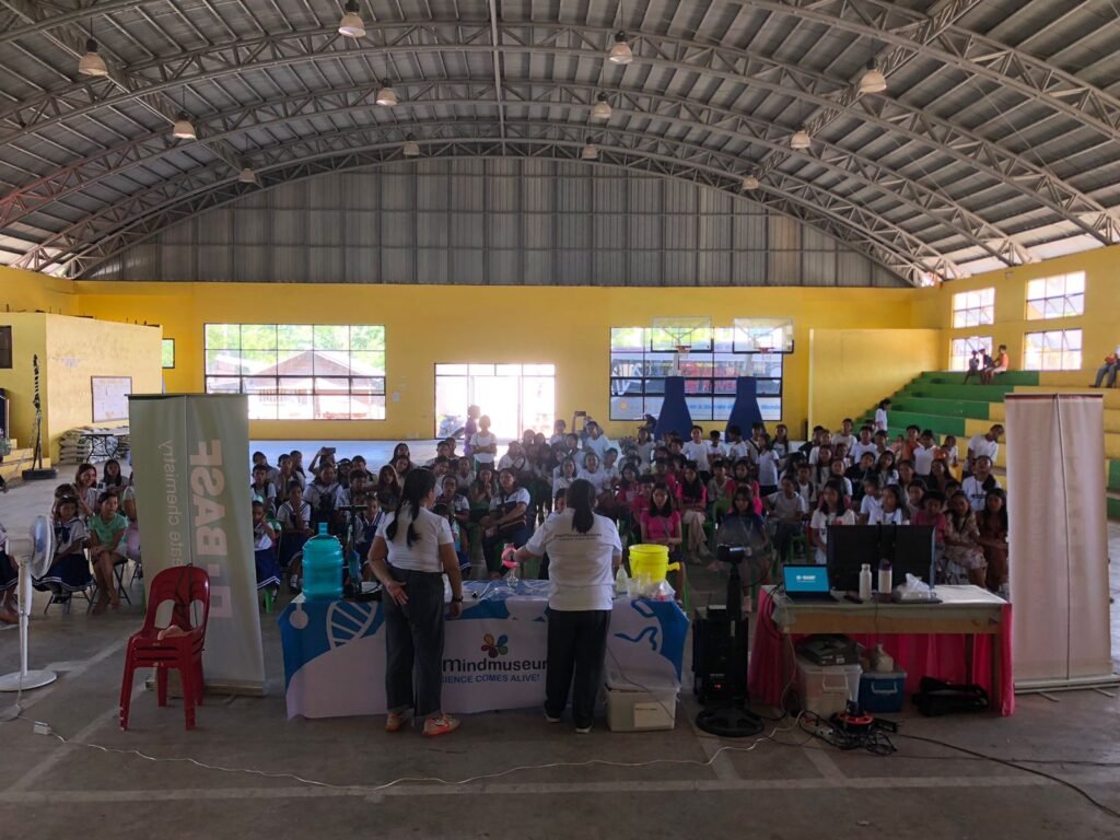 Students attending a Mind Museum science session in a covered hall