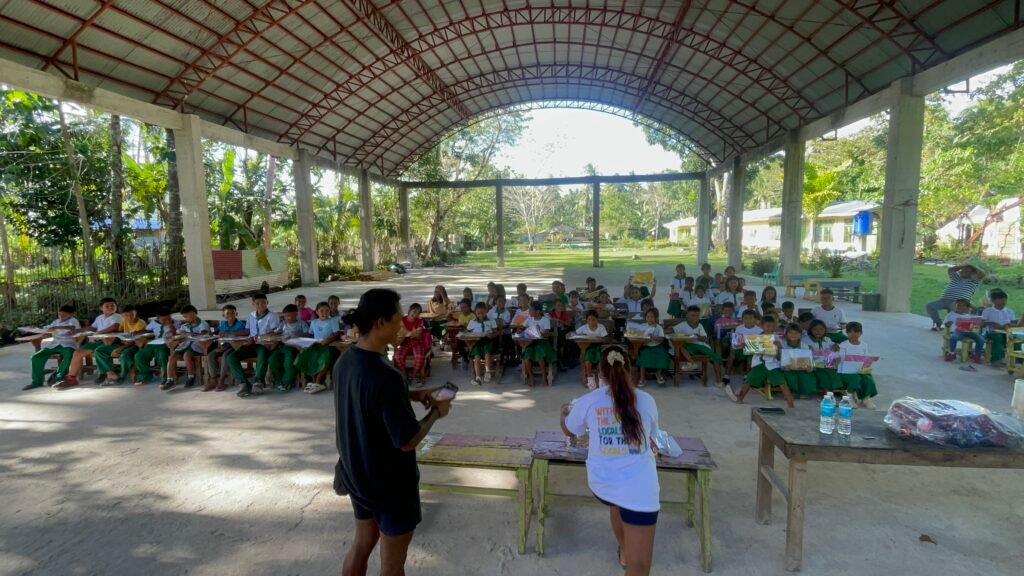 Students and volunteers gathered for school kit distribution in Montserrat, Dapa