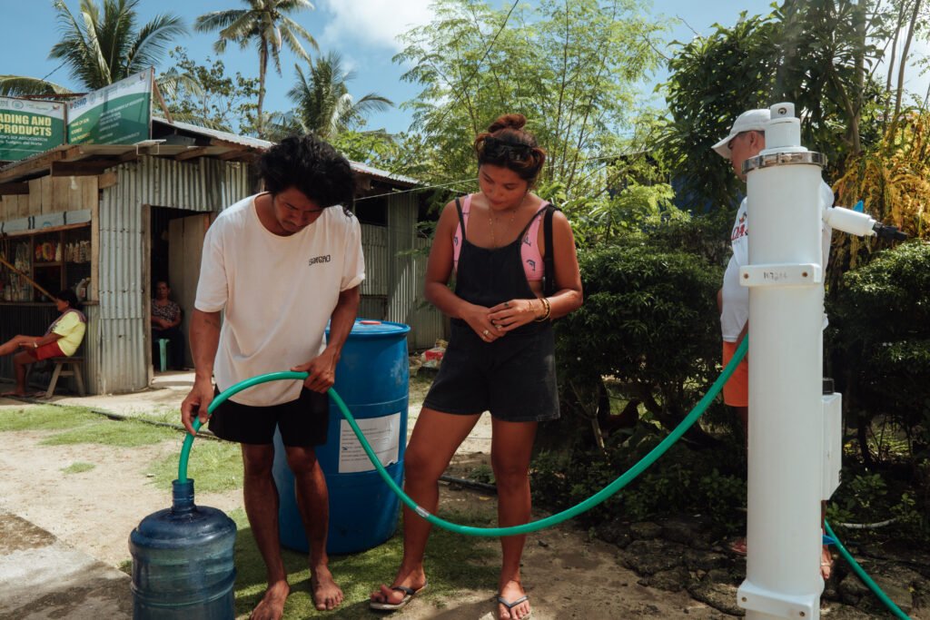 Filling a water container from the SkyHydrant in Monserrat